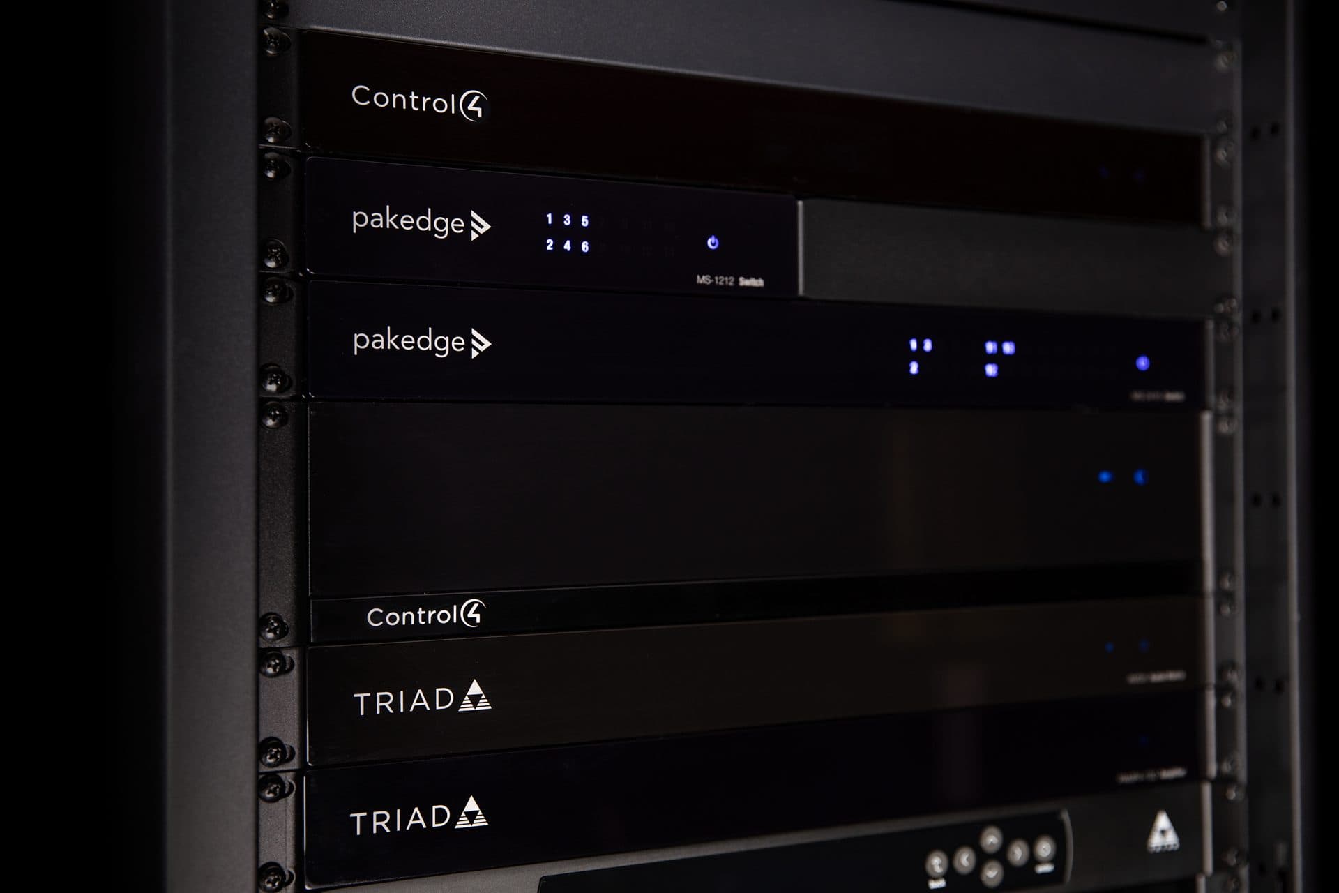 A neatly installed home network cabinet with structured cabling