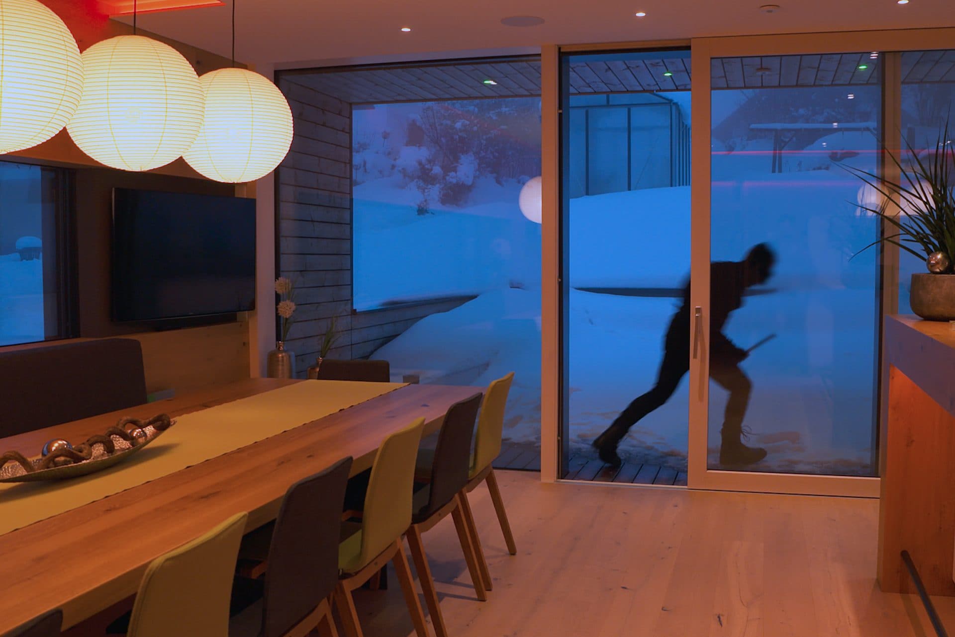 A contemporary home at dusk with architectural lighting